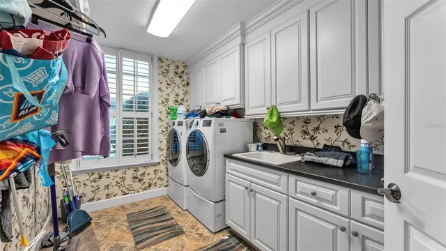 a bath tub sitting in a bathroom next to a window