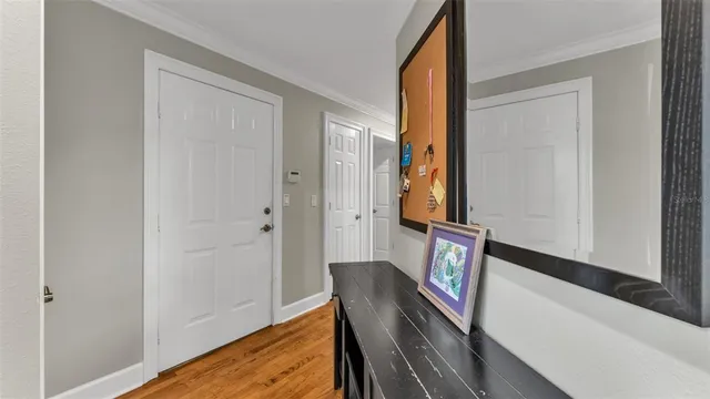 a room with a large window and furniture