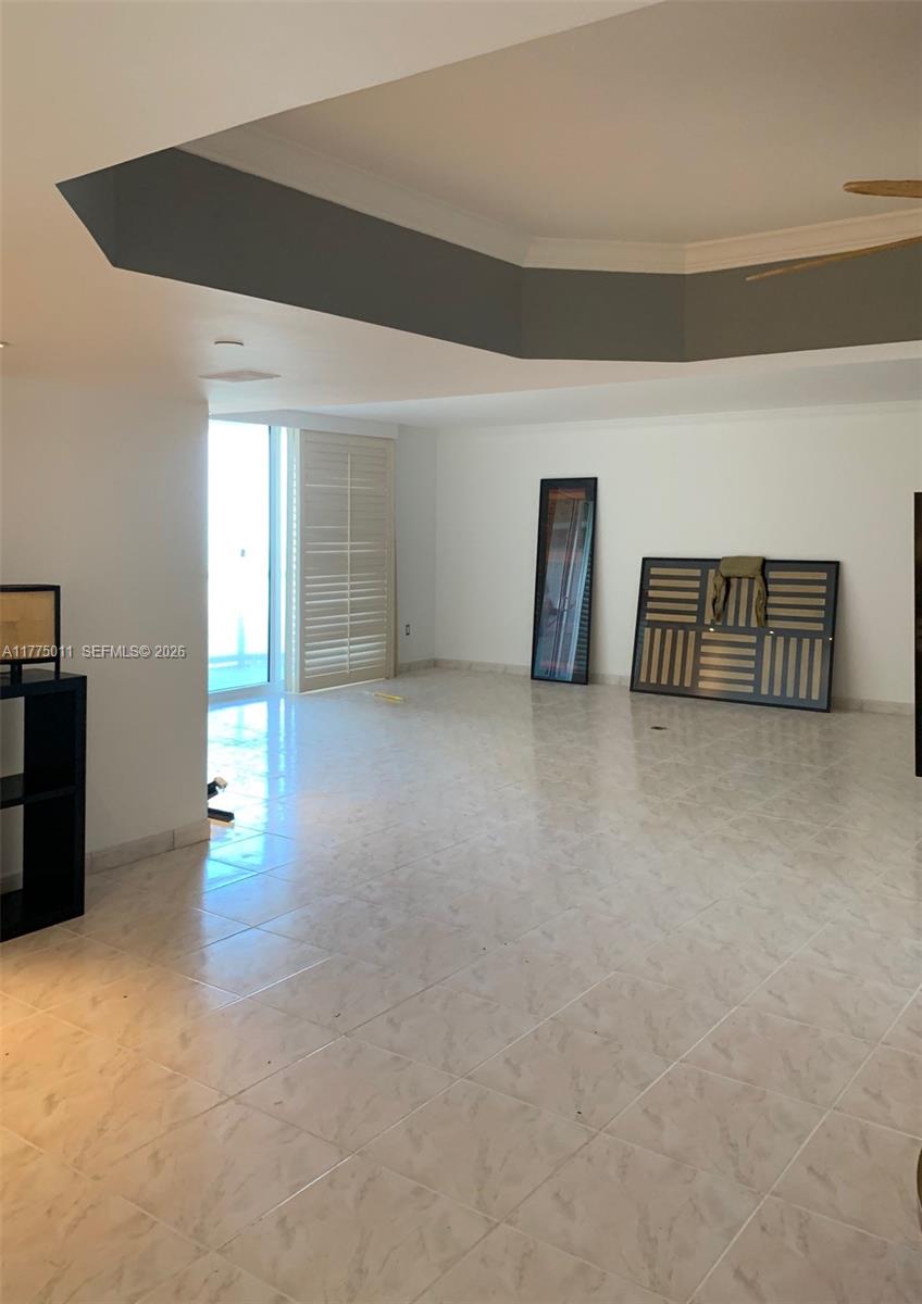 8855 Collins Avenue, Unit 5B Surfside, FL 33154 - Photo 15 of 35 a view of empty room with wooden floor