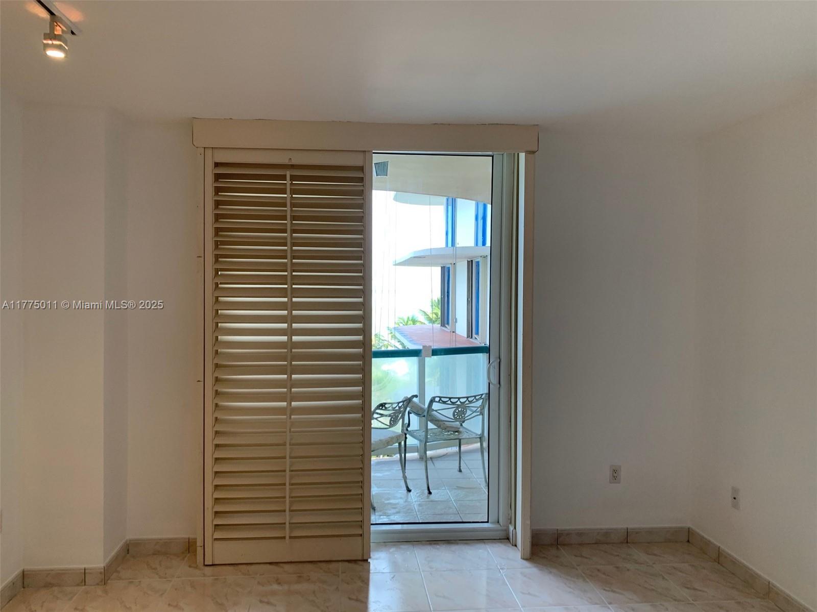 8855 Collins Avenue, Unit 5B Surfside, FL 33154 - Photo 26 of 36 plantaion shutters all around the apartment