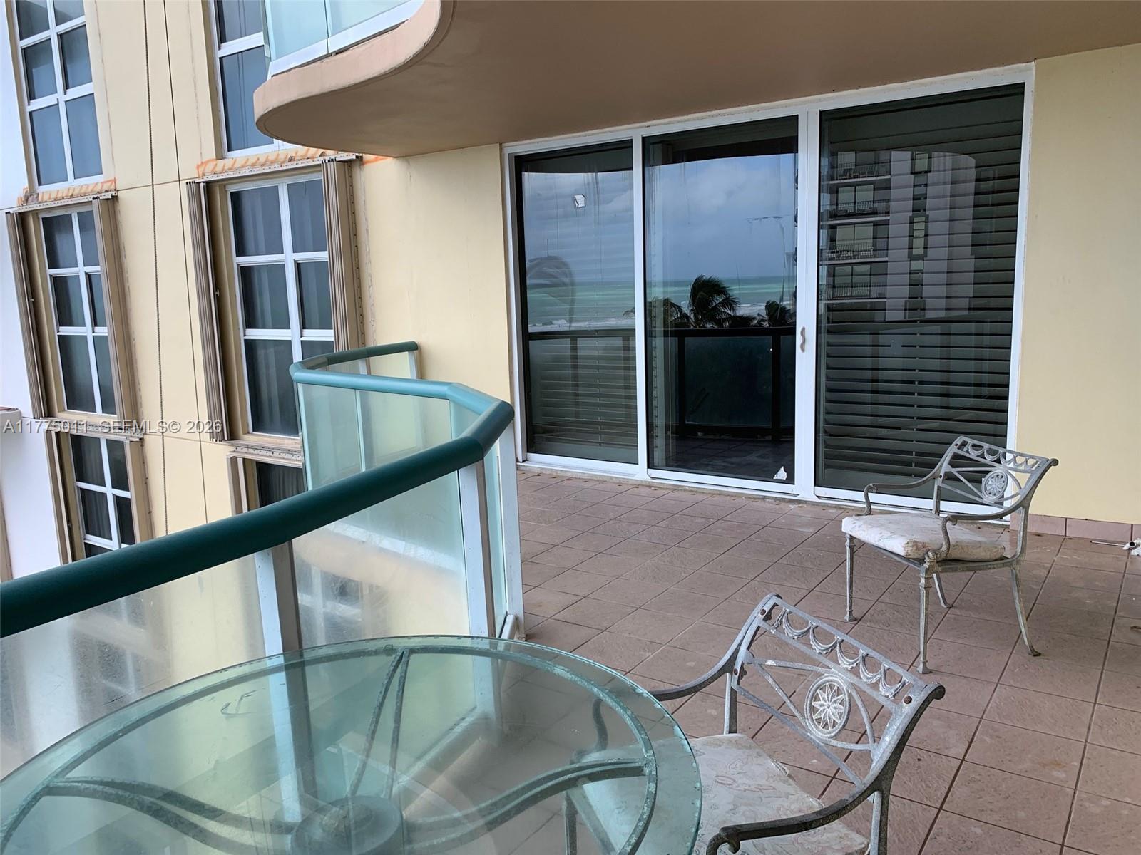 8855 Collins Avenue, Unit 5B Surfside, FL 33154 - Photo 30 of 35 a view of an outdoor seating