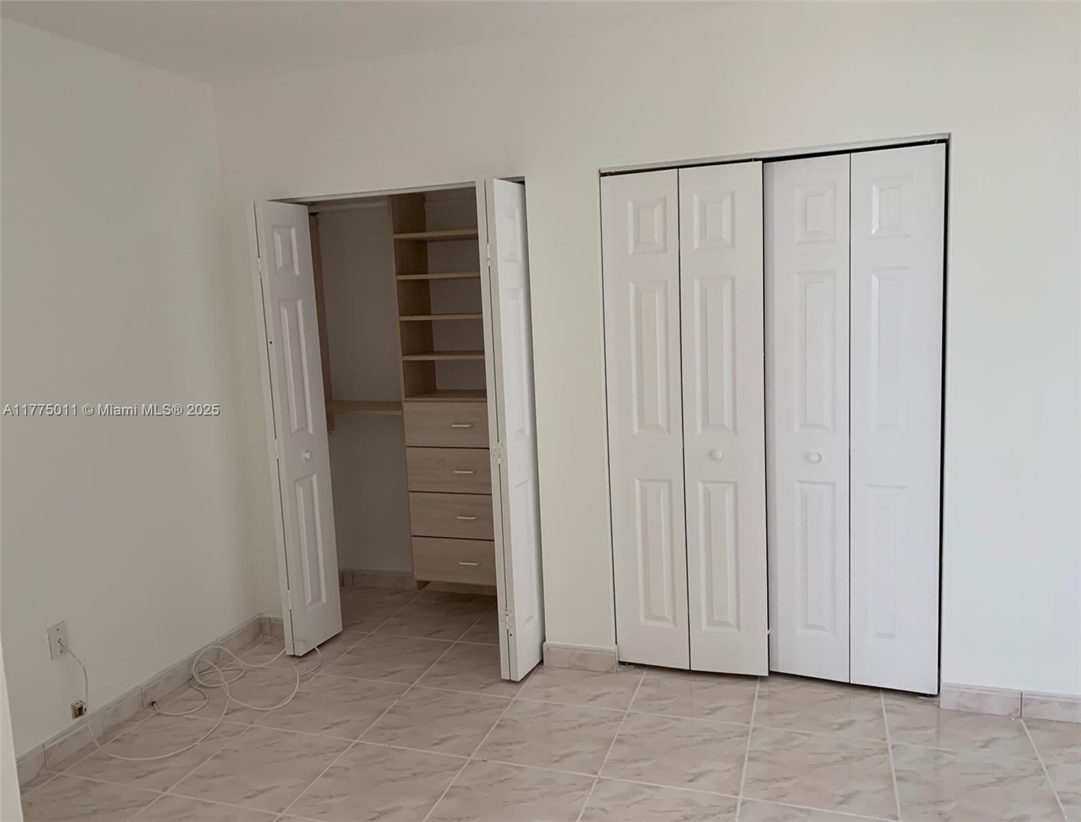8855 Collins Avenue, Unit 5B Surfside, FL 33154 - Photo 30 of 36 guest room with custom made closets