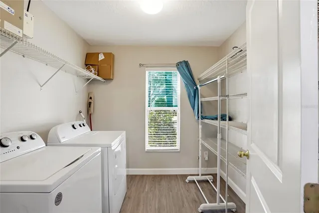 a bathroom with a sink toilet vanity and shower