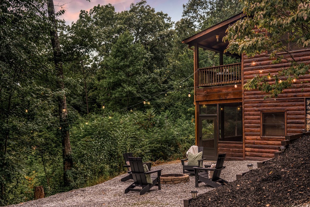 145 Daybreak Boulevard Morganton, GA 30560 - Photo 11 of 40 a backyard of a house with outdoor seating
