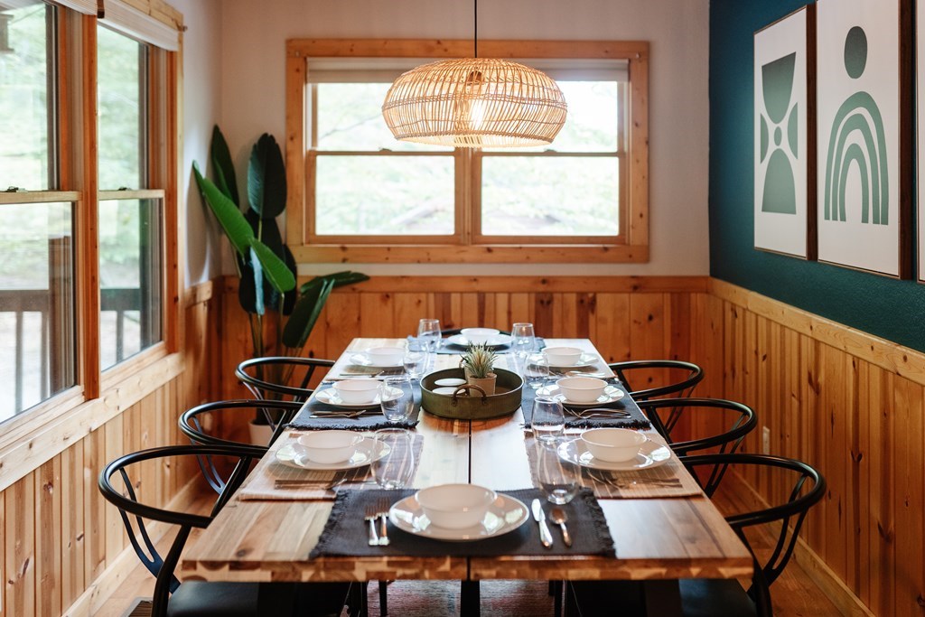 145 Daybreak Boulevard Morganton, GA 30560 - Photo 18 of 40 a view of a dining room with furniture a chandelier and large windows