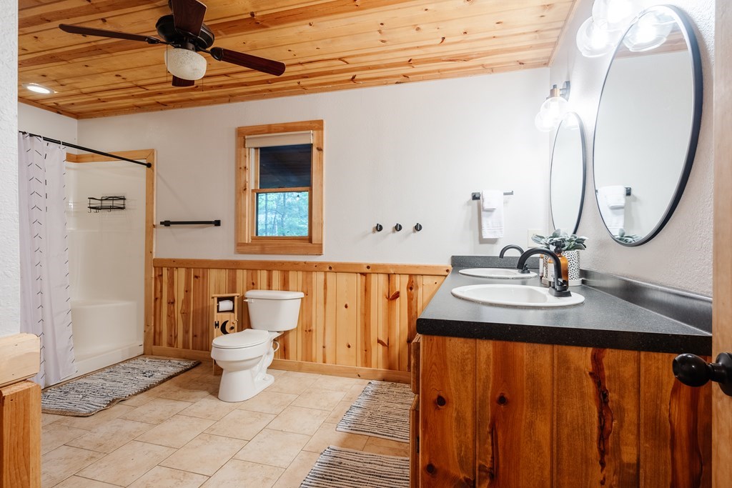145 Daybreak Boulevard Morganton, GA 30560 - Photo 21 of 40 a bathroom with a sink and a mirror