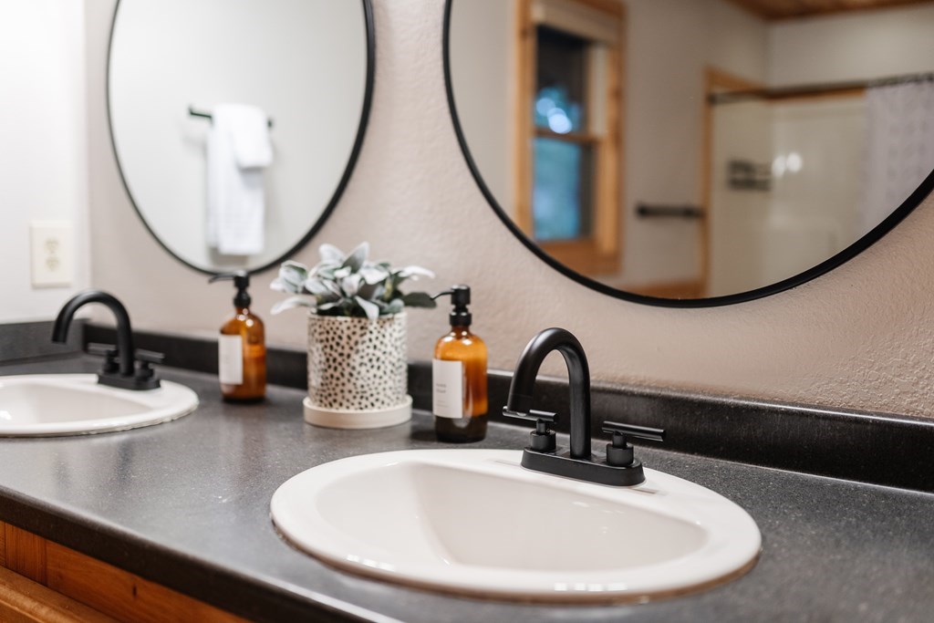 145 Daybreak Boulevard Morganton, GA 30560 - Photo 24 of 40 a bathroom with a sink and a mirror