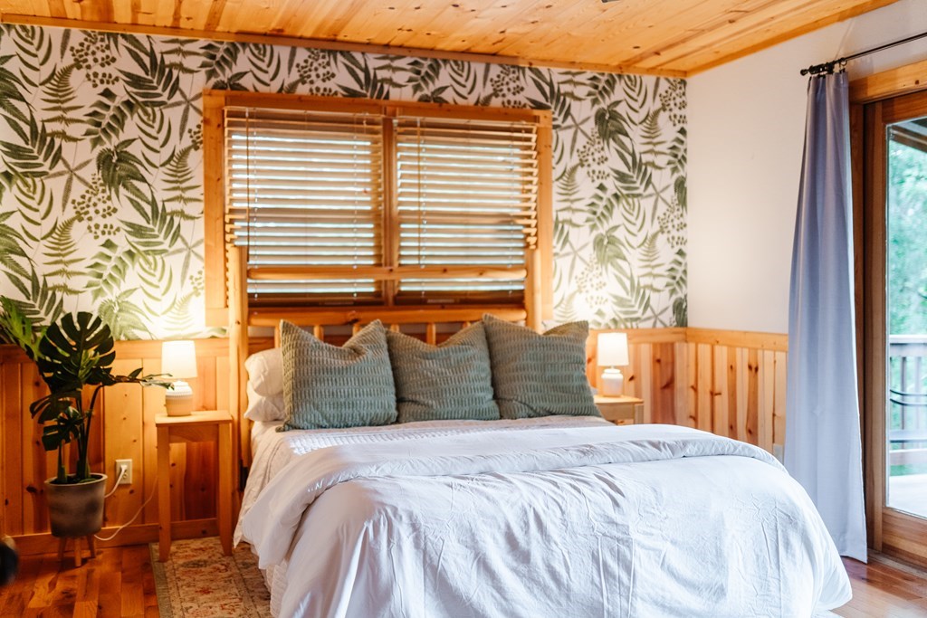 145 Daybreak Boulevard Morganton, GA 30560 - Photo 26 of 40 a bedroom with a bed and a window