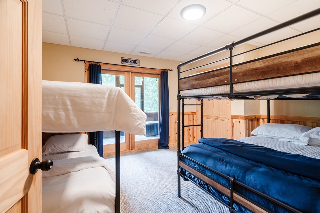 145 Daybreak Boulevard Morganton, GA 30560 - Photo 37 of 40 a bedroom with a bed and wooden floor