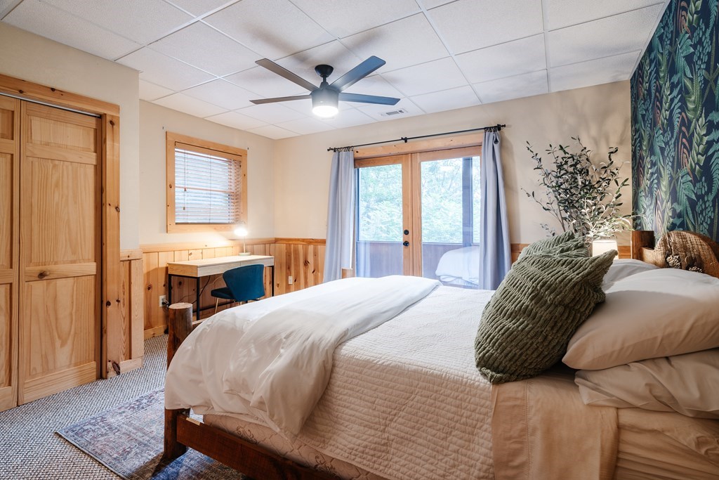 145 Daybreak Boulevard Morganton, GA 30560 - Photo 39 of 40 a bedroom with a large bed and a chandelier