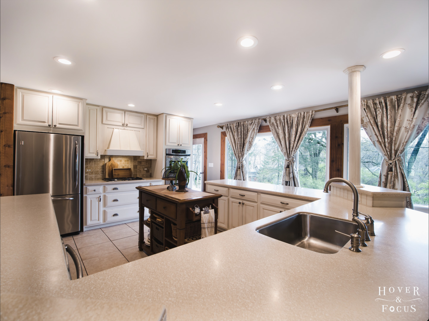 109 Turkey Run Road Trout Valley, IL 60013 - Photo 13 of 50 a kitchen with stainless steel appliances a refrigerator a sink a stove and white cabinets