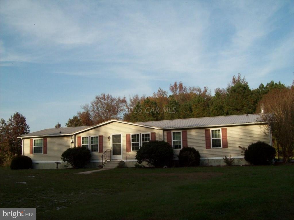 3477 Texas Road Bivalve, MD 21814 - Photo 3 of 32 a front view of a house with a garden