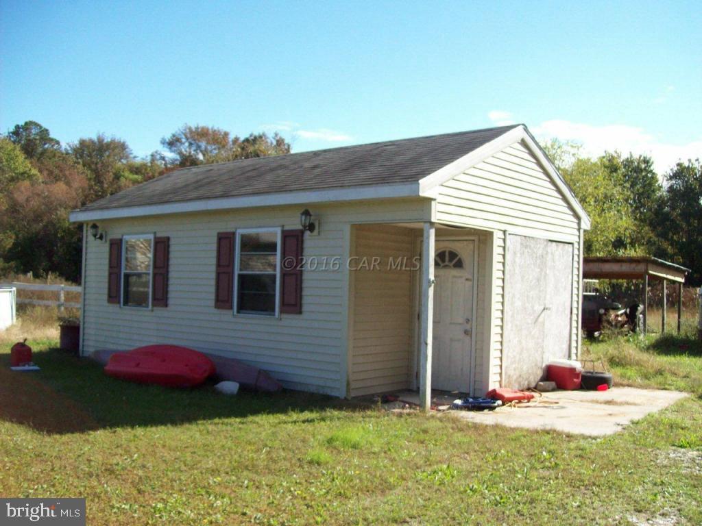 3477 Texas Road Bivalve, MD 21814 - Photo 5 of 32 a front view of a house with a yard