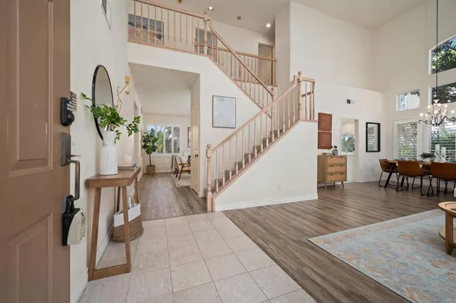 a view of entryway and hall with wooden floor