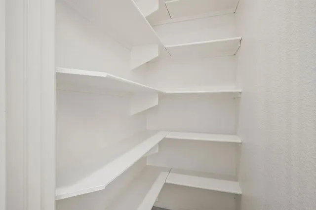 a view of an empty walk in closet