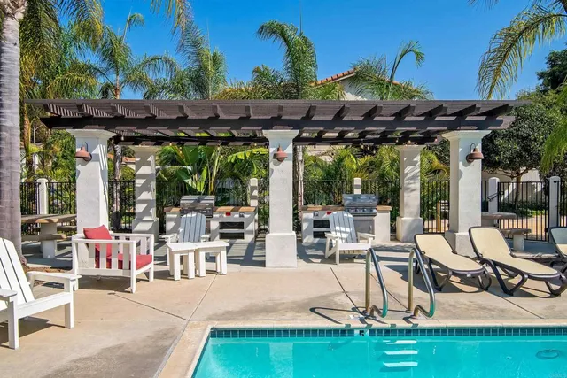 a view of a chairs and table in patio
