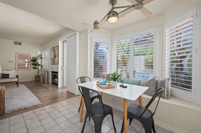a view of a dining room with furniture and window