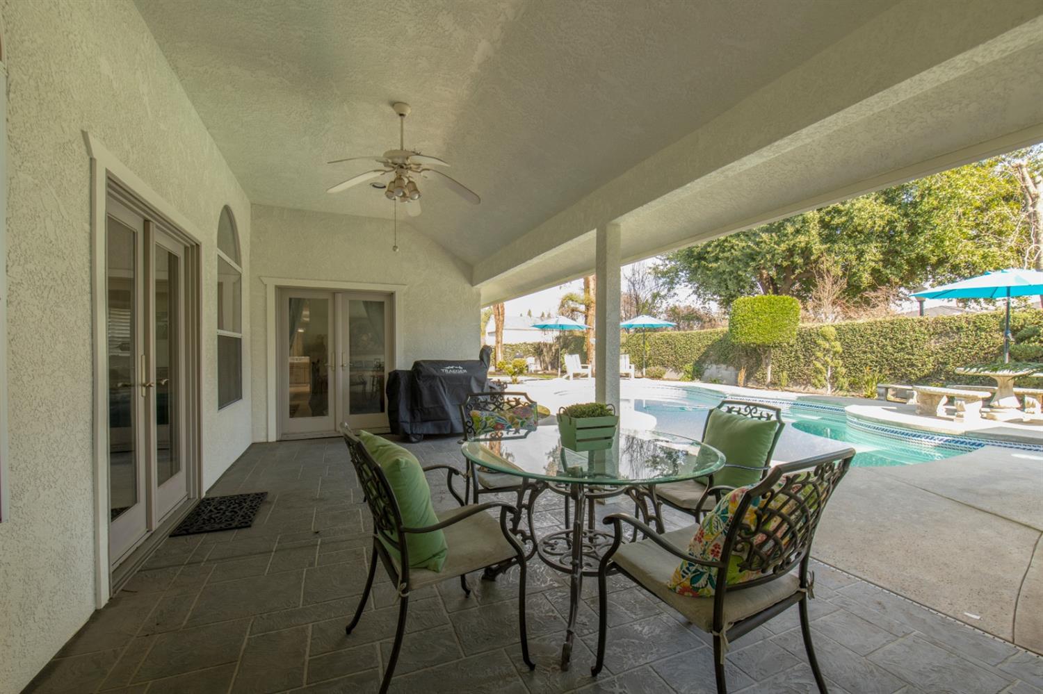 2873 Carolina Avenue Clovis, CA 93611 - Photo 21 of 23 a dining room with furniture a rug and a floor to ceiling window