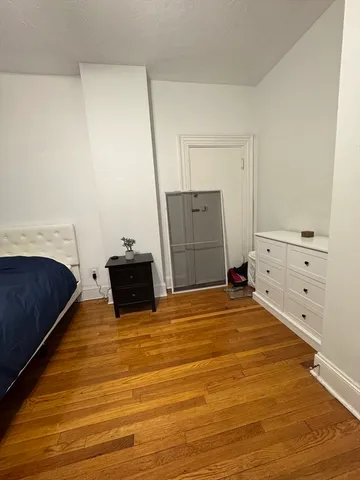 a room with a bed and cabinets