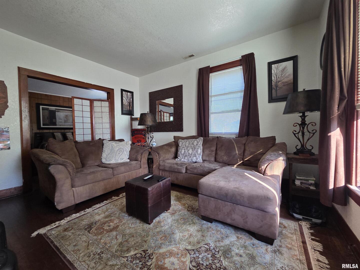800 6th Avenue South Clinton, IA 52732 - Photo 5 of 12 a living room with furniture and a flat screen tv