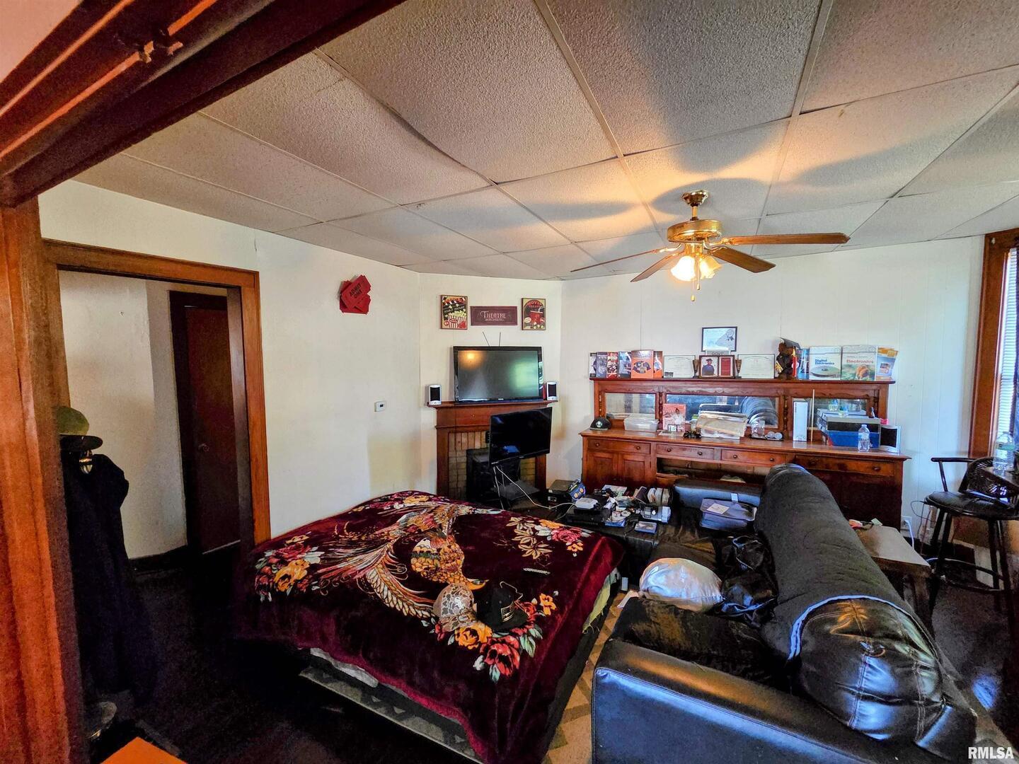 800 6th Avenue South Clinton, IA 52732 - Photo 10 of 12 a living room with lots of furniture and a chandelier
