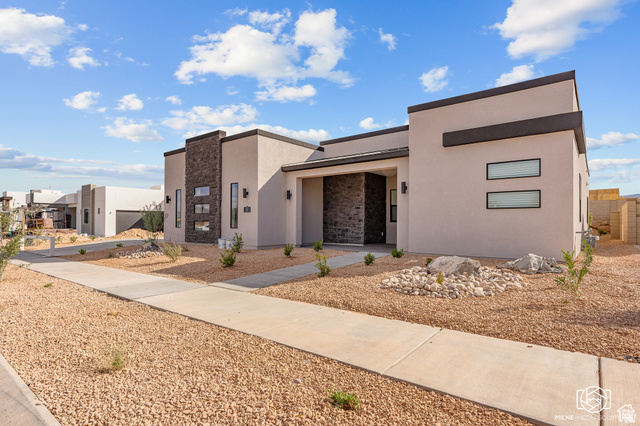 707 Spring Lily Drive St. George, UT 84790 - Photo 2 of 43 Contemporary exterior with stucco facade and stone accents
