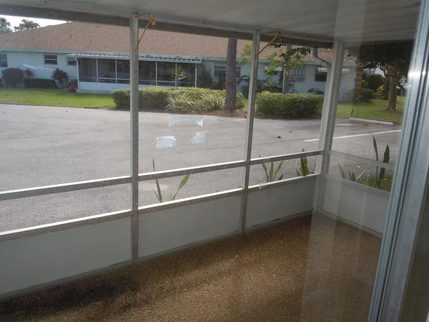 727 High Point Boulevard, Unit A Fort Pierce, FL 34982 - Photo 21 of 24 Covered&Screened Patio