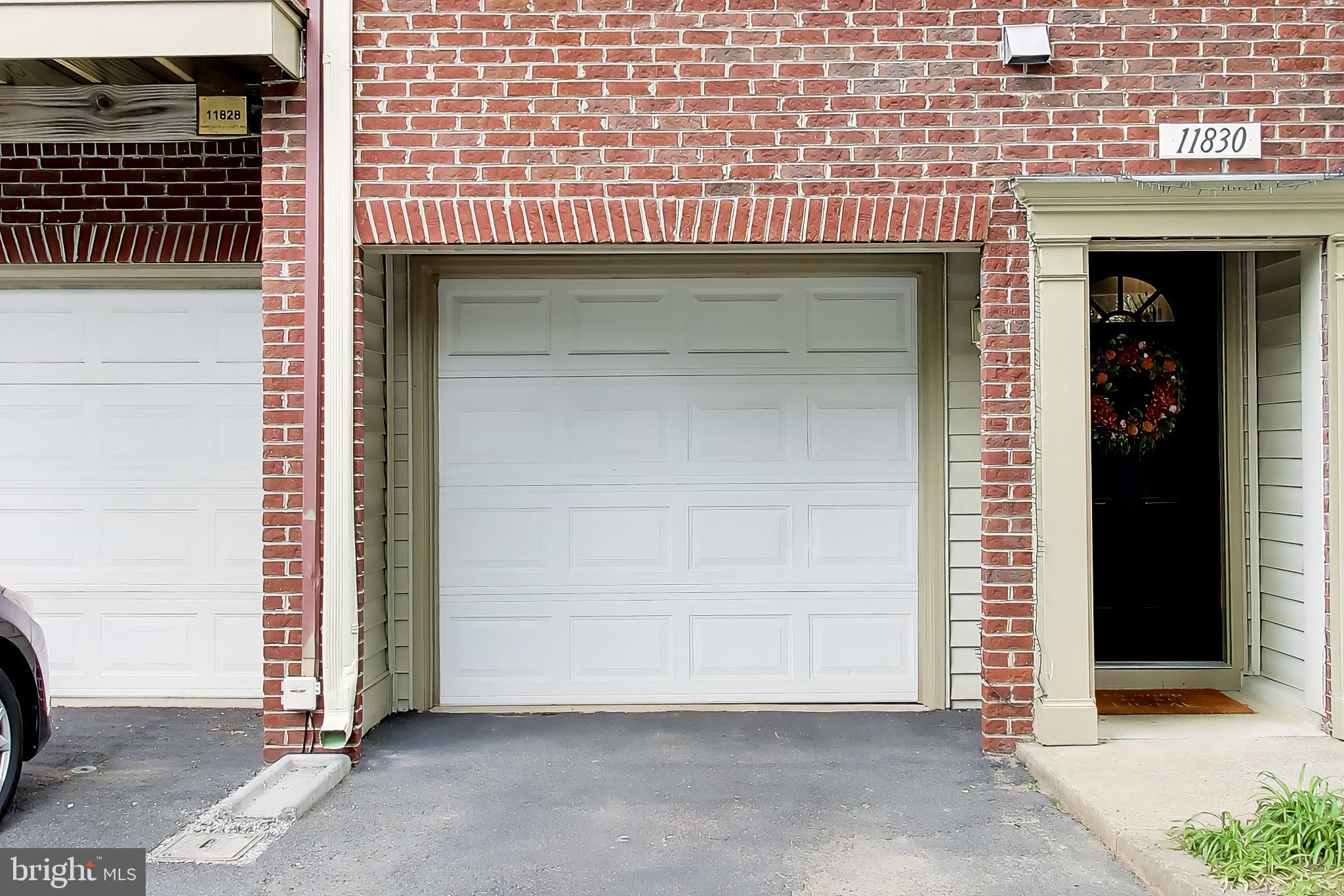 11830 Breton Court, Unit 23B Reston, VA 20191 - Photo 3 of 43 Charming brick facade with garage access.