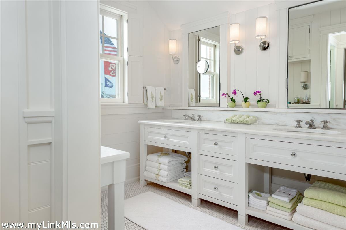 37 Sankaty Head Road Nantucket, MA 02554 - Photo 40 of 65 a bathroom with a sink and a mirror