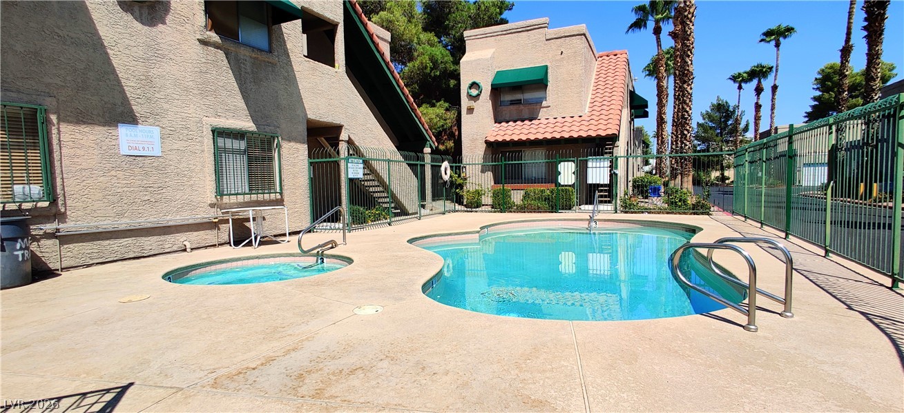 6750 Del Rey Avenue, Unit 267 Las Vegas, NV 89146 - Photo 20 of 20 A pristine pool beckons, surrounded by desert landscaping and an inviting outdoor setting.