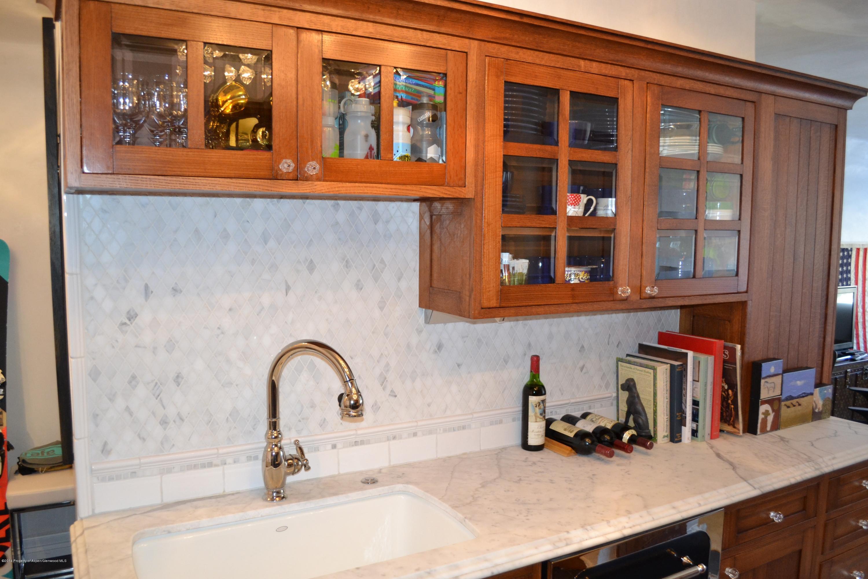 1041 Vine Street Aspen, CO 81611 - Photo 7 of 16 a kitchen with a sink and cabinets
