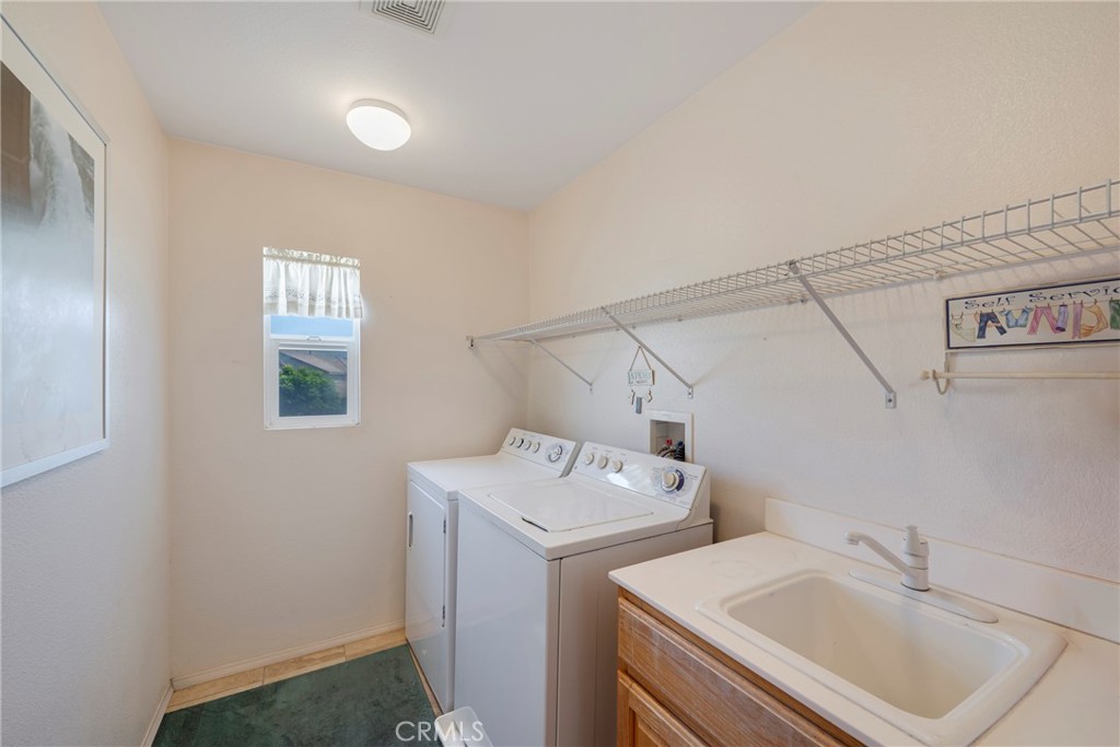 3819 St Austell Way Perris, CA 92571 - Photo 28 of 64 a utility room with dryer and washer