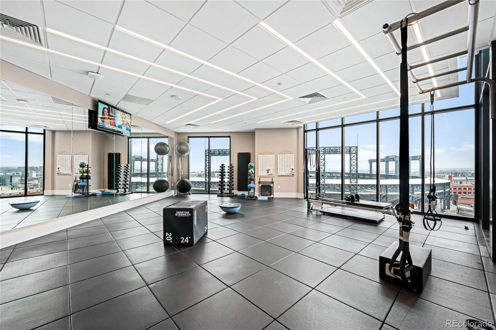 1901 Wazee Street, Unit 304 Denver, CO 80202 - Photo 24 of 38 a lobby with furniture and floor to ceiling window