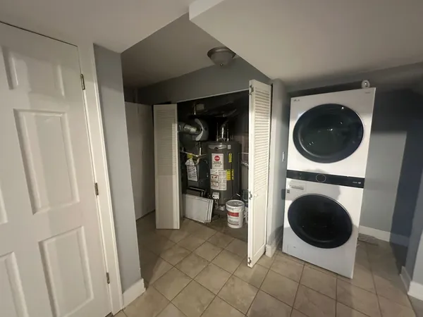 a view of a hallway with washer and dryer