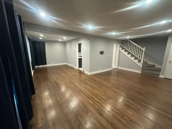 a view of hallway with wooden floor