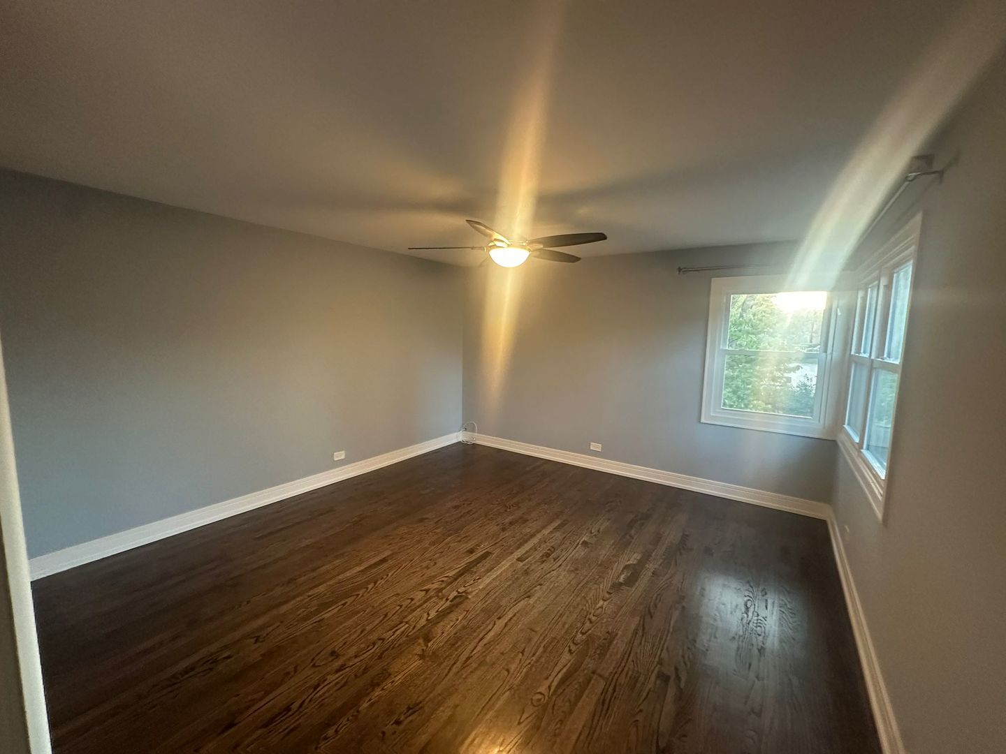 2543 Crawford Avenue, Unit 2543 Evanston, IL 60201 - Photo 9 of 17 wooden floor in an empty room