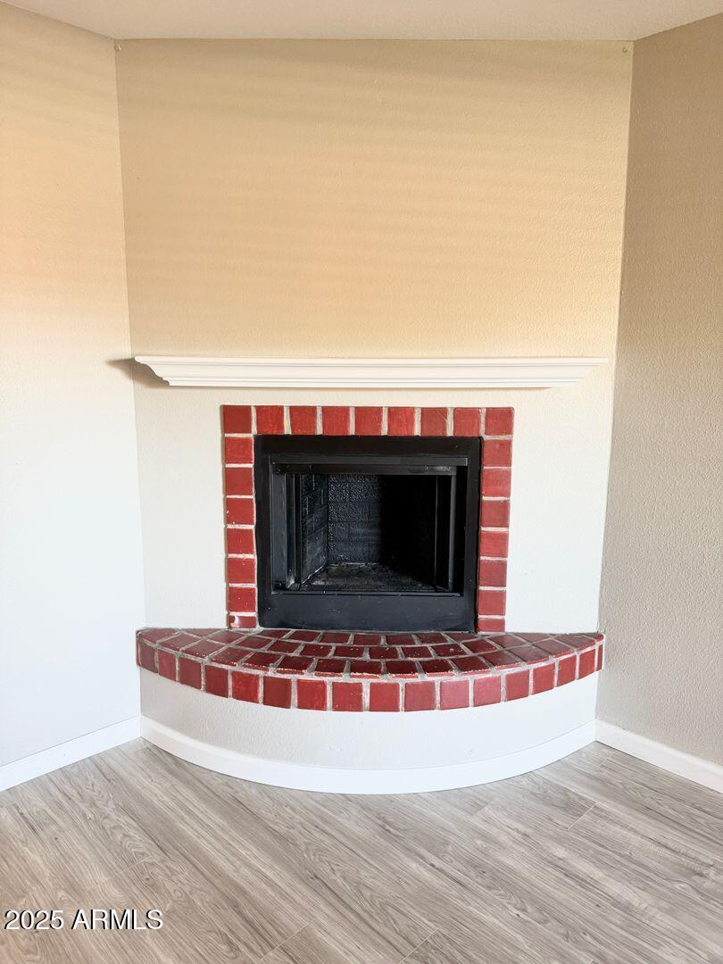 1425 East Desert Cove Avenue, Unit 2 Phoenix, AZ 85020 - Photo 11 of 42 a view of fireplace and wooden floor