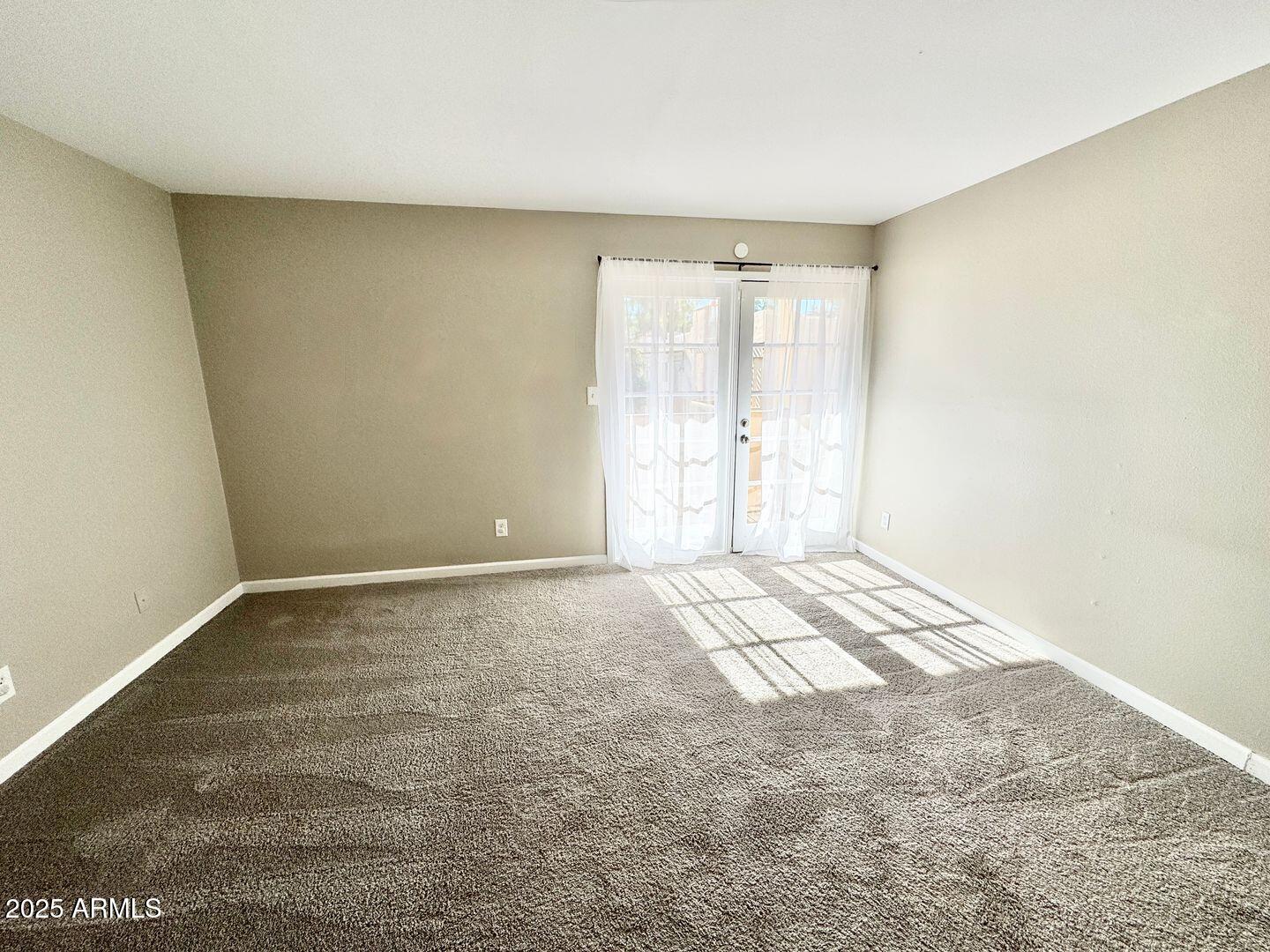 1425 East Desert Cove Avenue, Unit 2 Phoenix, AZ 85020 - Photo 29 of 42 a view of an empty room and window