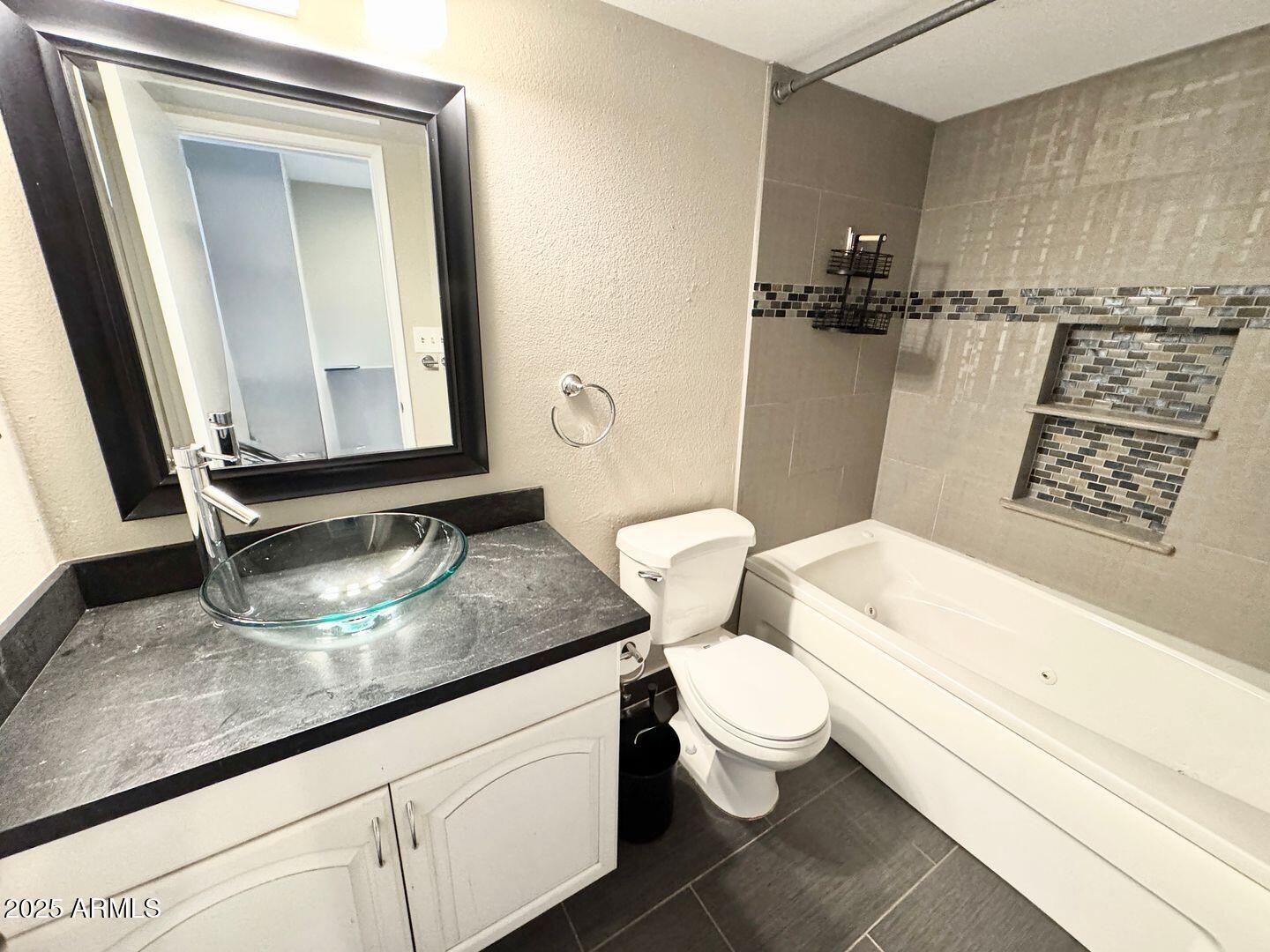 1425 East Desert Cove Avenue, Unit 2 Phoenix, AZ 85020 - Photo 34 of 42 a bathroom with a granite countertop sink mirror vanity and toilet