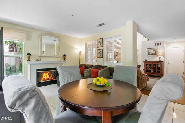 a living room with furniture and fireplace