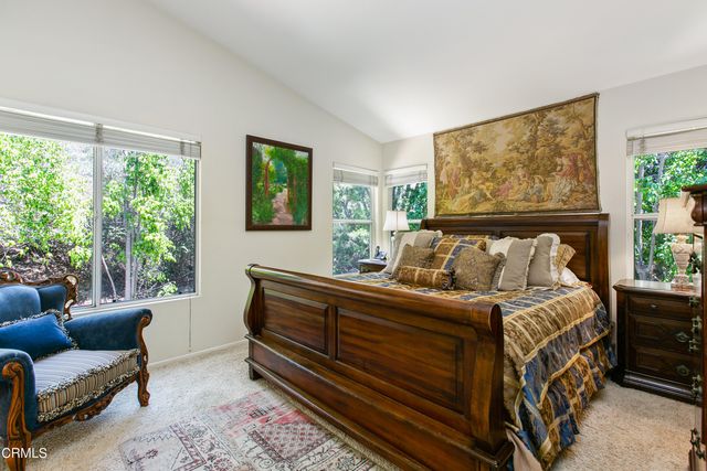 a bed room with furniture and a window