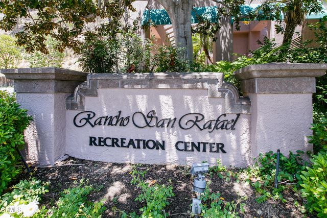 a sign that is on a wooden wall