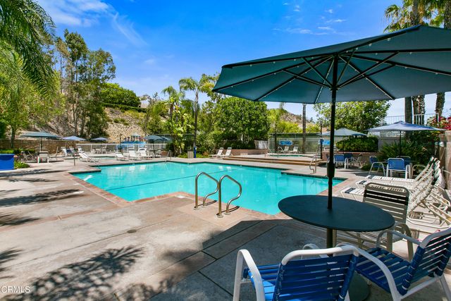 a view of a backyard with sitting area