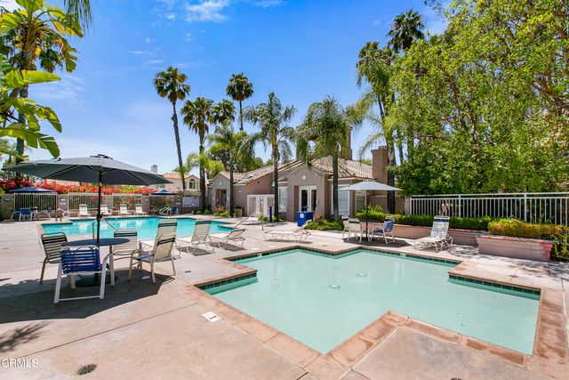 a view of a swimming pool with chairs