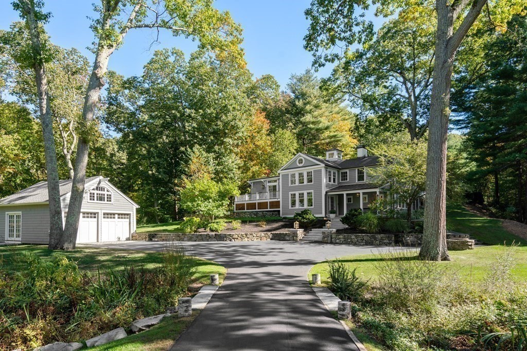 88 Pine Street Dover, MA 02030 - Photo 1 of 40 a front view of a house with a yard and green space