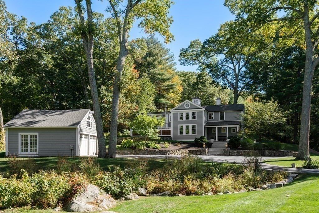 88 Pine Street Dover, MA 02030 - Photo 31 of 40 a front view of a house with a yard