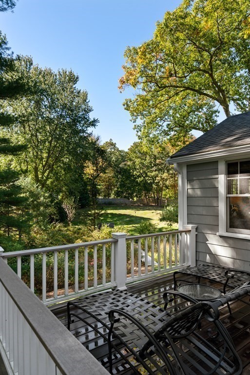 88 Pine Street Dover, MA 02030 - Photo 35 of 40 a view of a balcony with wooden floor and outdoor seating