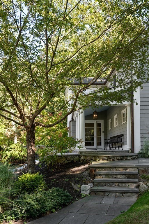 88 Pine Street Dover, MA 02030 - Photo 36 of 40 a front view of a house with a garden