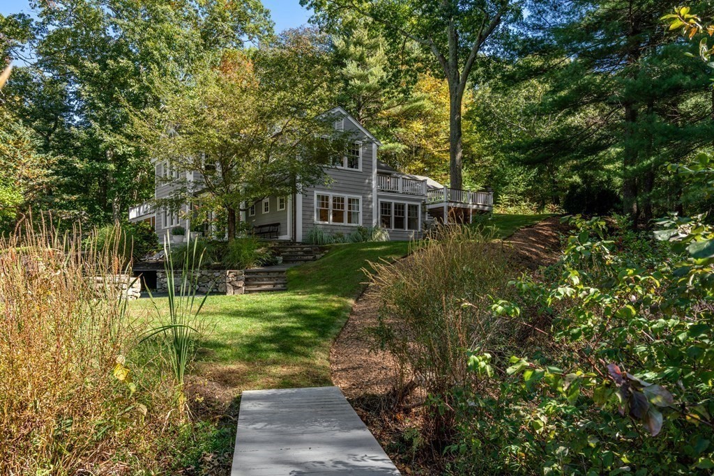 88 Pine Street Dover, MA 02030 - Photo 37 of 40 a view of a house with a backyard