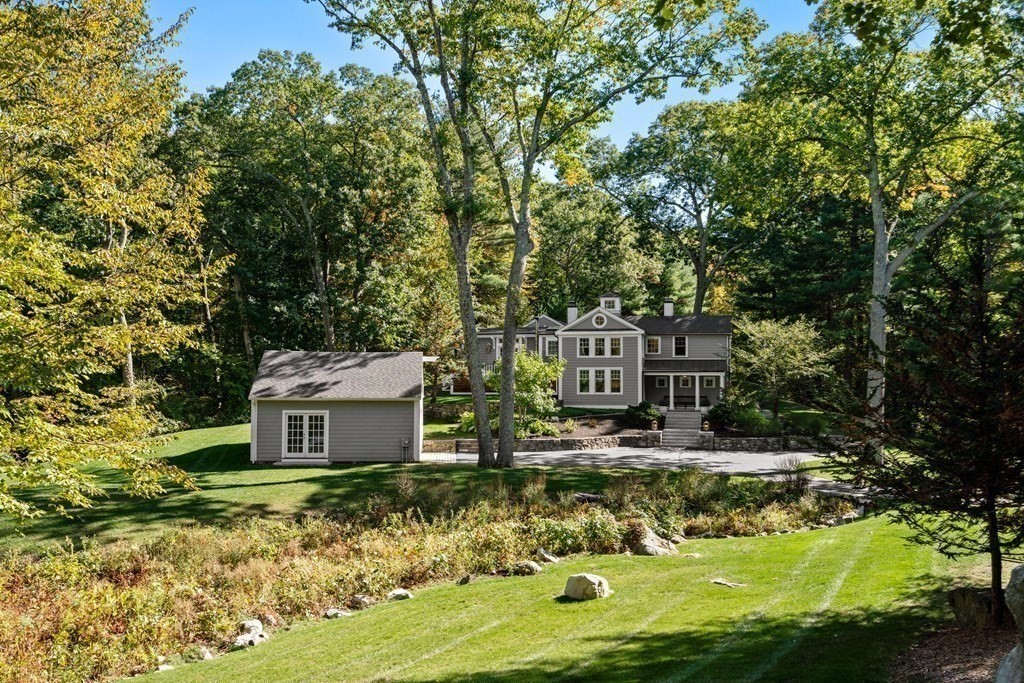 88 Pine Street Dover, MA 02030 - Photo 38 of 40 a view of a house with a yard